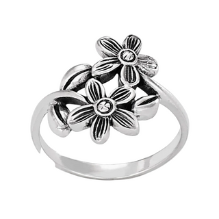 silver ring with two daisies on a white background