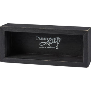 Everything Is Figureoutable box sign styled on a desk