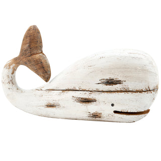 Large white wooden whale sitter styled on a shelf