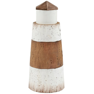 Small rustic white wooden lighthouse styled on a table