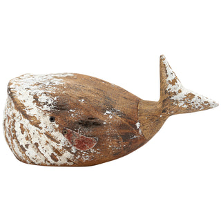Small white wooden whale sitter styled on a table