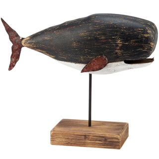 Black wooden whale on stand
