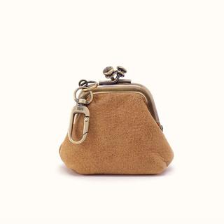 A small tan suede kiss-lock coin purse with antique bronze metal hardware and a detachable keychain clip, shown on a clean white background.