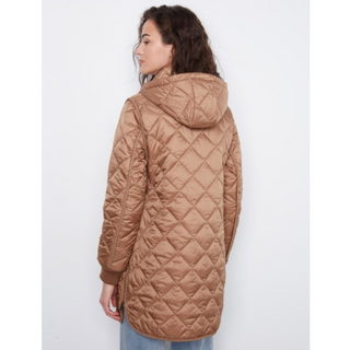 A woman shown from the back wearing a quilted hooded puffer jacket in a warm camel brown color, paired with light blue jeans, against a plain white background.