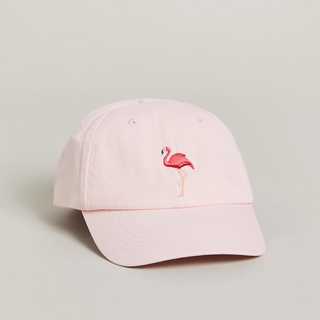 A light pink cotton baseball cap featuring an embroidered pink flamingo on the front, set against a neutral light gray background.