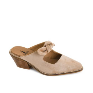 A single women's mule sandal in light beige suede with a low stacked wood-look heel and a matching fabric bow detail across the top, shown on a plain white background.