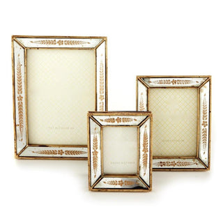 Three rectangular picture frames in a nested set, featuring distressed gold frames with white textured inner mats and decorative gold leaf-like corner motifs.