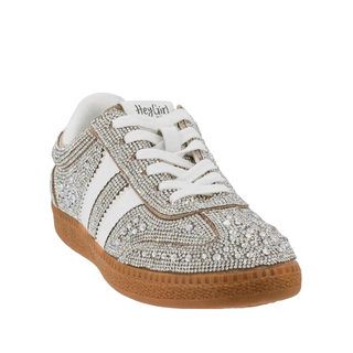 A low-top sneaker embellished with silver rhinestones, featuring white leather side stripes, white laces, a white tongue label with 'Heyfür' printed on it, and a brown gum sole.