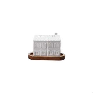 Stoneware house salt and pepper shakers on wood tray